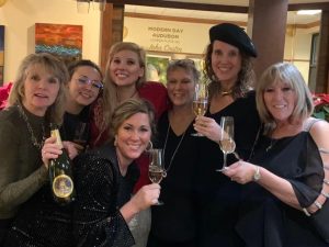 amy thorn with many women at a wine tasting event